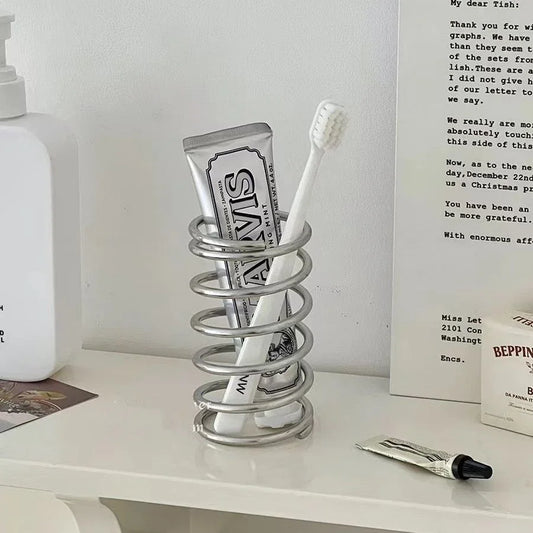 Spring Toothbrush Holder